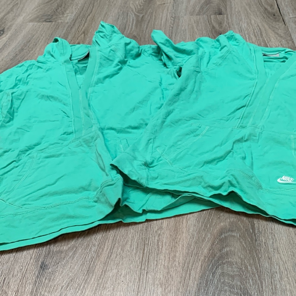 Two green matching Nike hoodies different sizes. XL and L